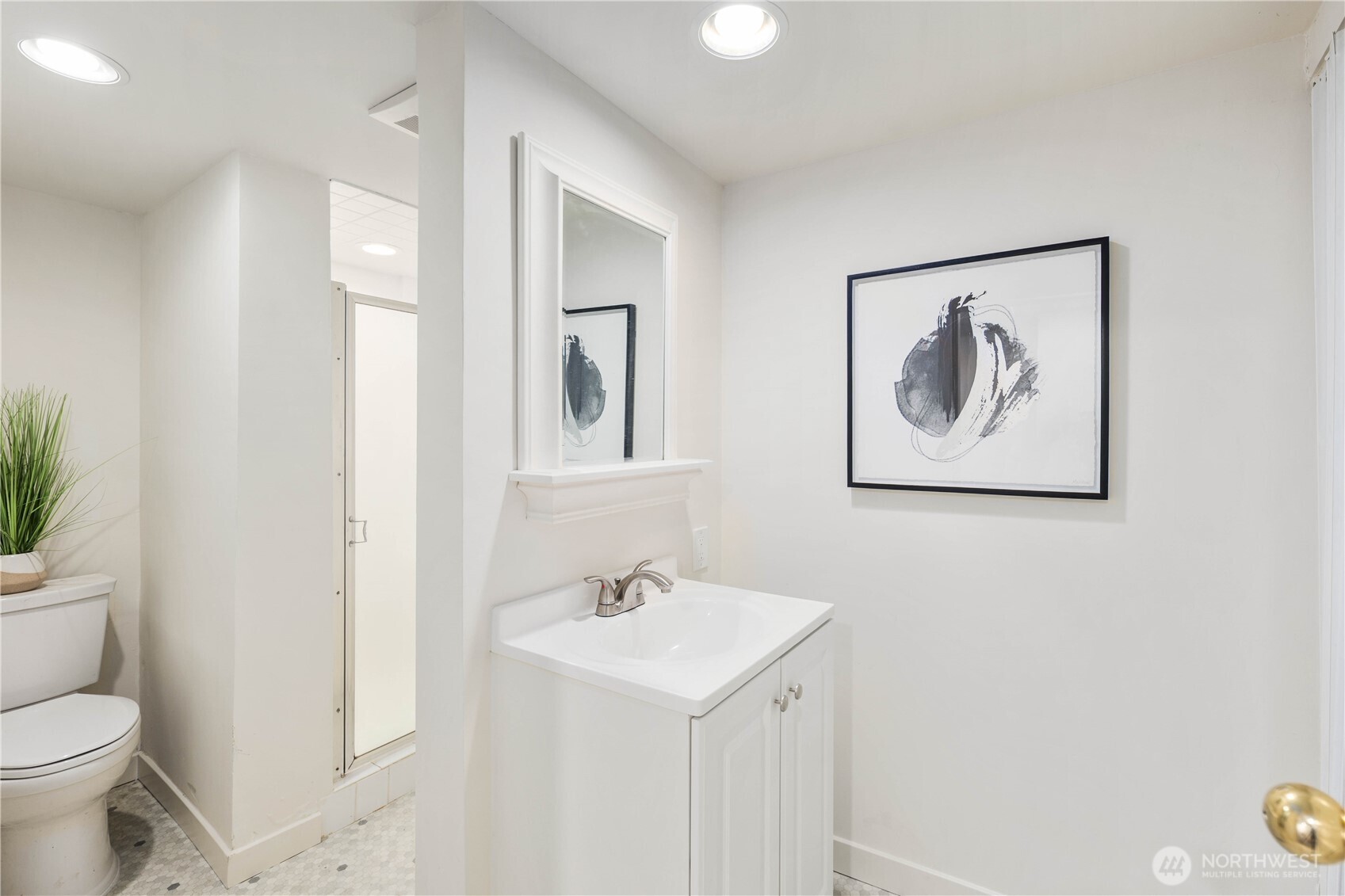 641 Northwest 175th Street Shoreline, WA 98177 - Photo 27 of 40 a bathroom with a sink a toilet and a mirror