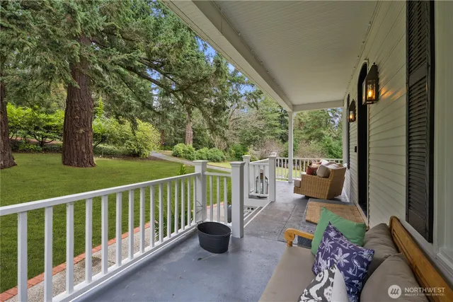 a balcony with potted plants and a view of lake