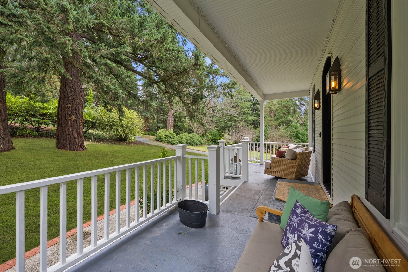 641 Northwest 175th Street Shoreline, WA 98177 - Photo 3 of 40 a balcony with potted plants and a view of lake