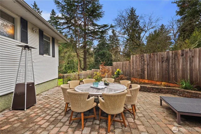 a view of a patio with a table and chairs