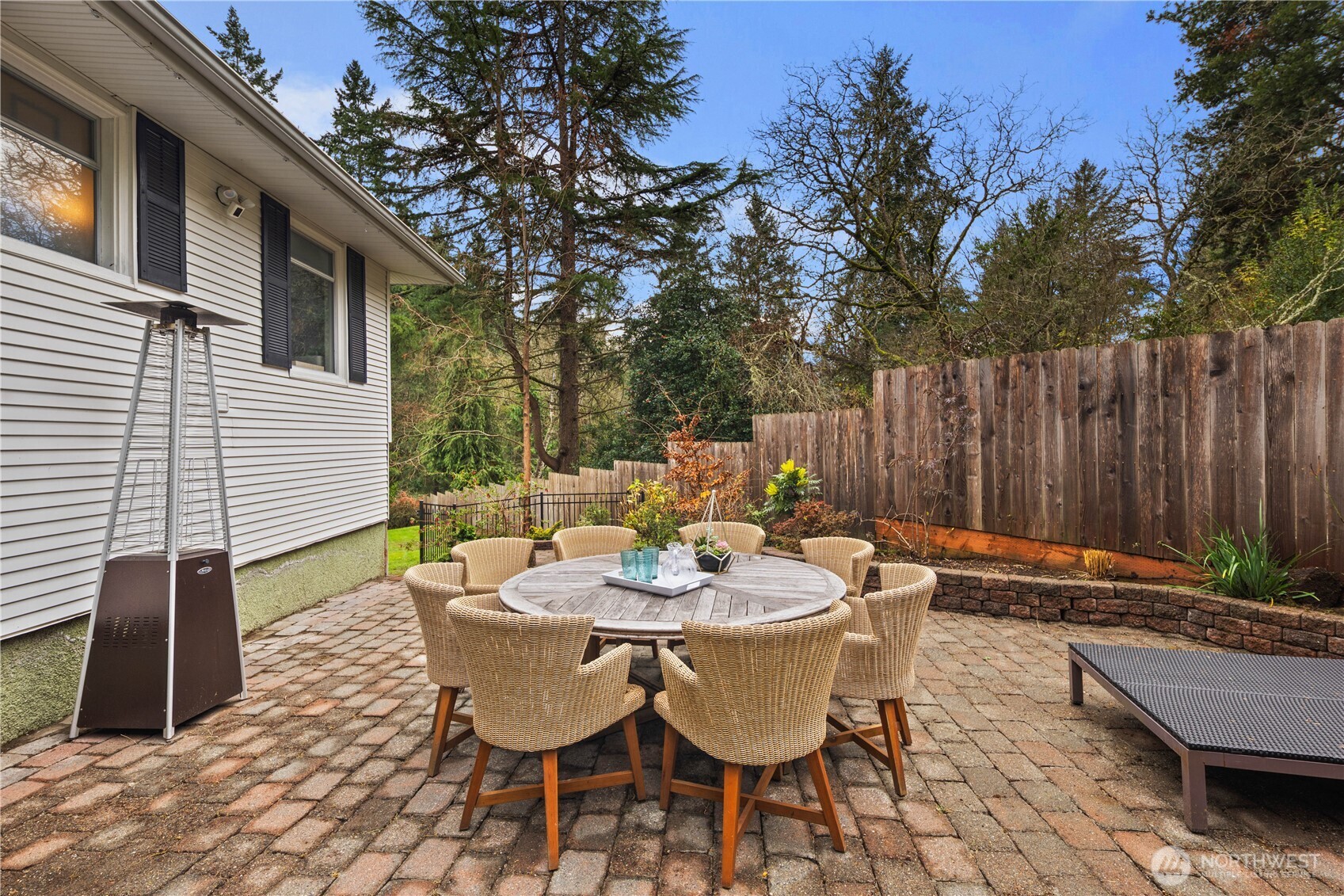 641 Northwest 175th Street Shoreline, WA 98177 - Photo 31 of 40 a backyard of a house with table and chairs