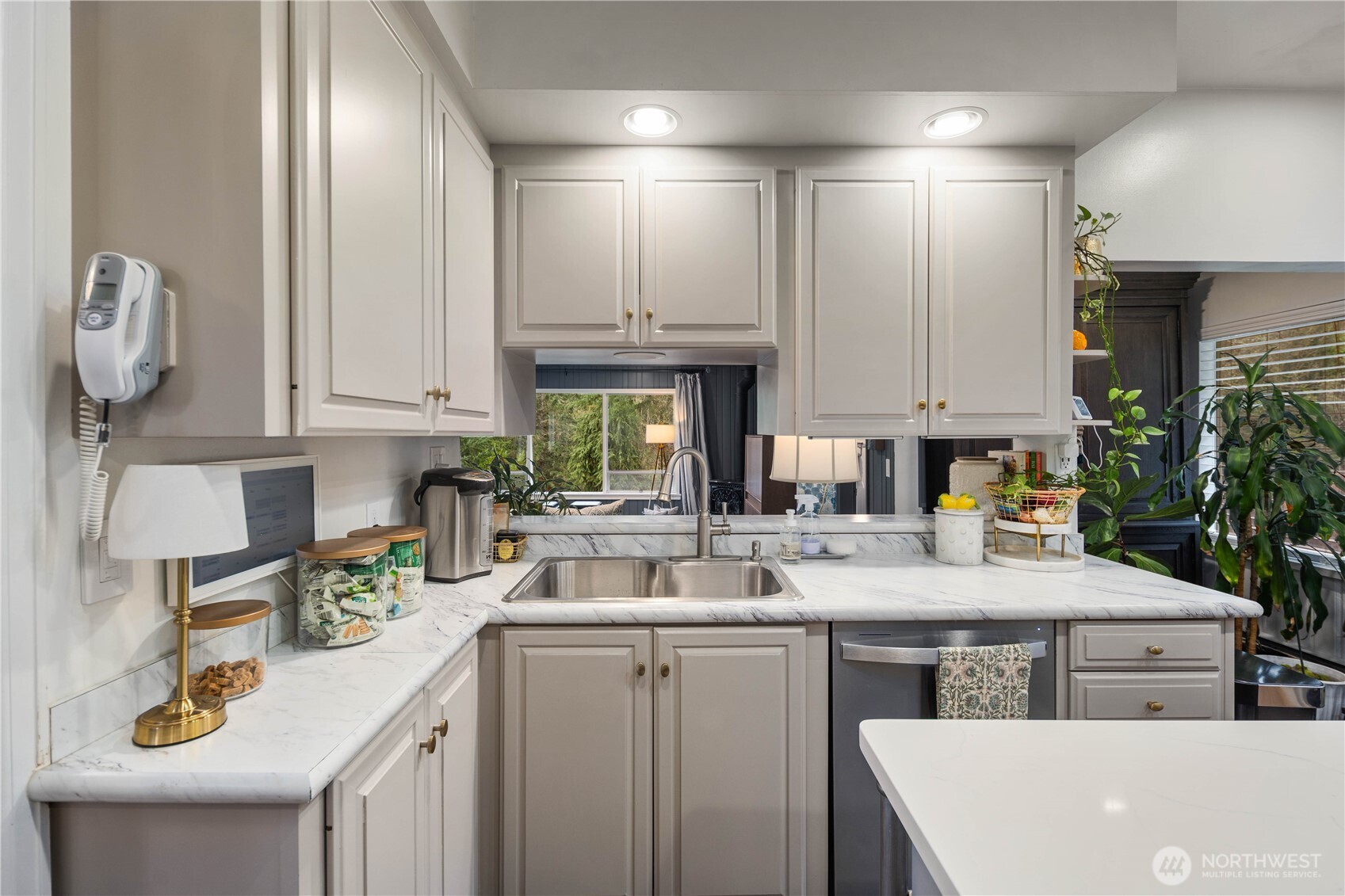 641 Northwest 175th Street Shoreline, WA 98177 - Photo 9 of 40 a kitchen with a sink a stove cabinets and counter space