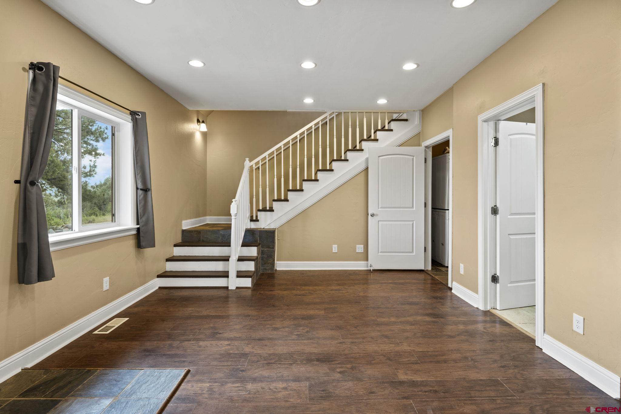 447 Mountain Top Road Durango, CO 81303 - Photo 6 of 33 a view of entryway and hall with wooden floor