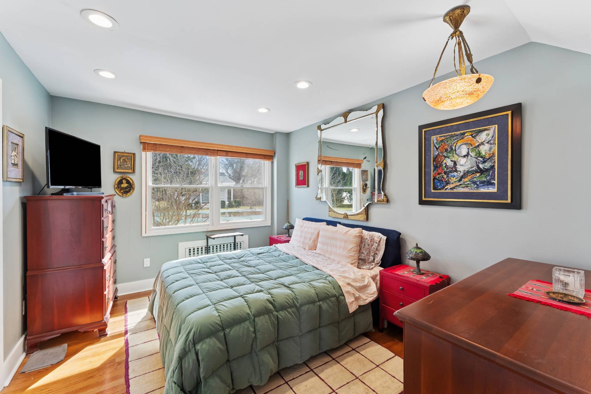 11 Oneck Road Westhampton Beach, NY 11978 - Photo 12 of 34 a bedroom with a bed and a flat screen tv