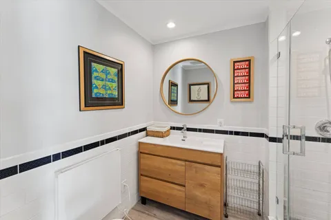 a bathroom with a sink and a mirror