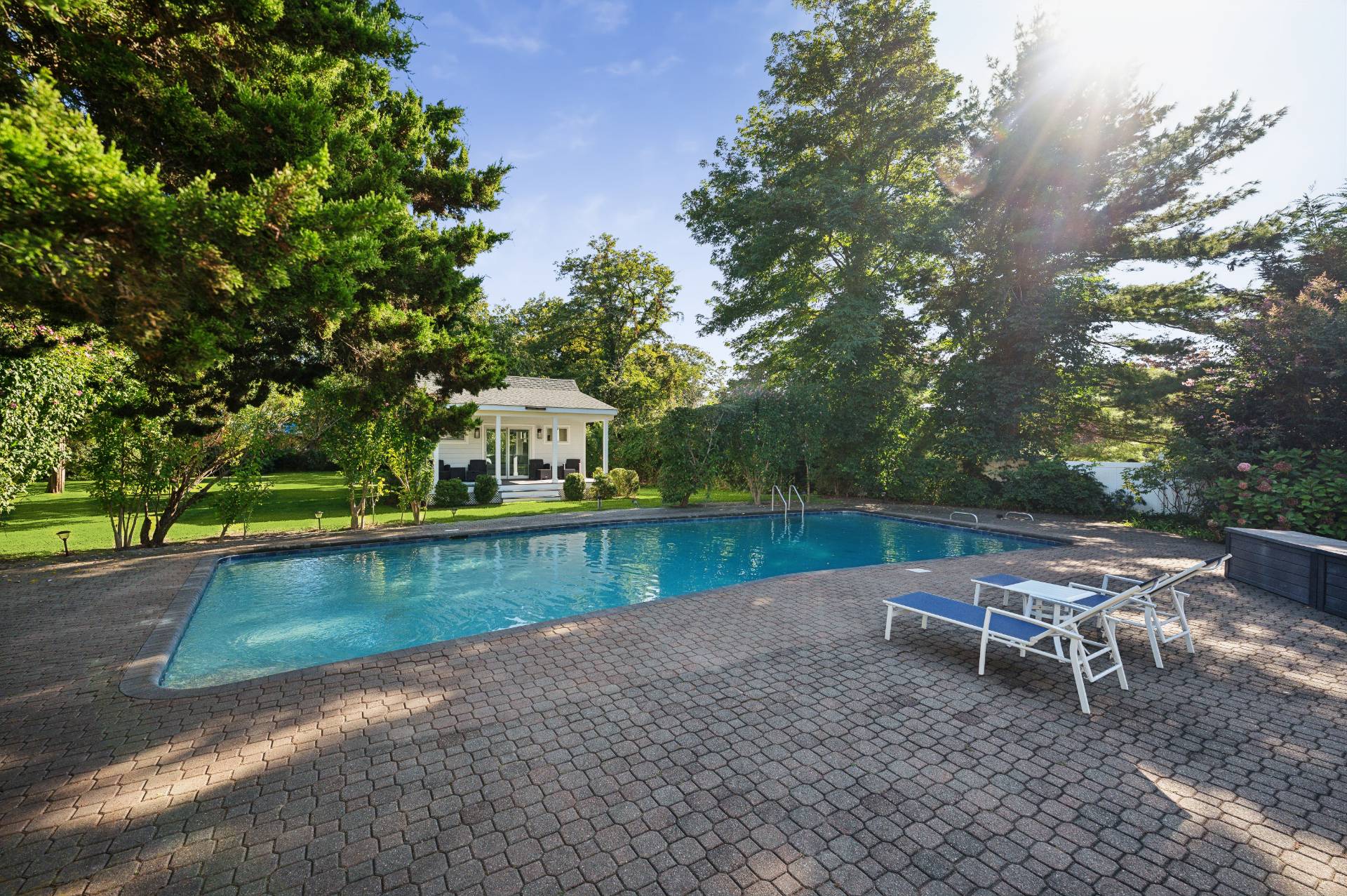 11 Oneck Road Westhampton Beach, NY 11978 - Photo 23 of 34 a view of a lake with a bench and trees