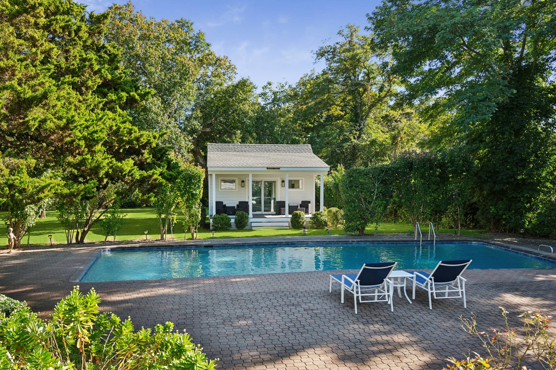 11 Oneck Road Westhampton Beach, NY 11978 - Photo 24 of 34 a view of a patio with chair and table and chairs under an umbrella