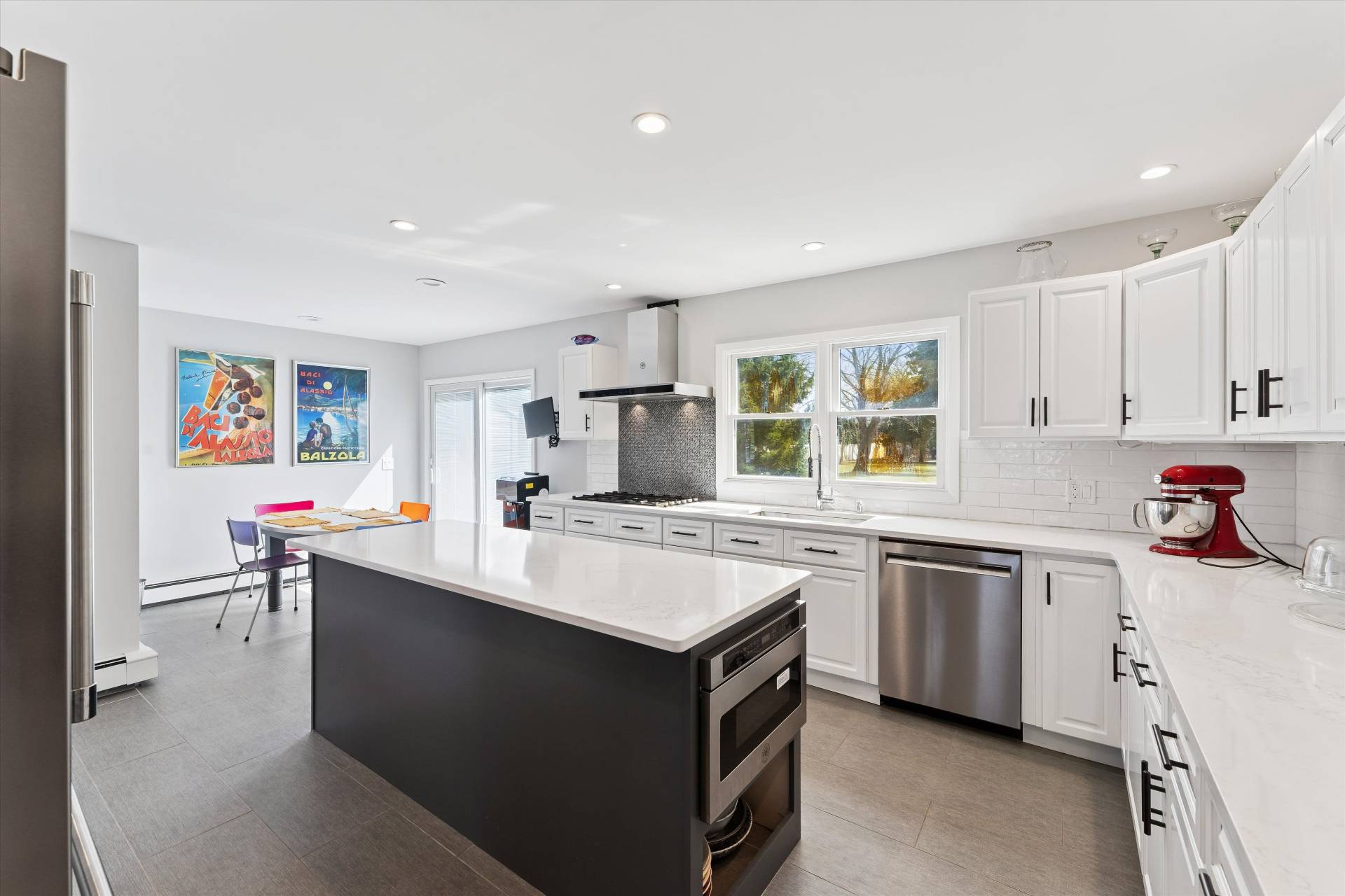 11 Oneck Road Westhampton Beach, NY 11978 - Photo 5 of 34 a kitchen with a sink stove and cabinets