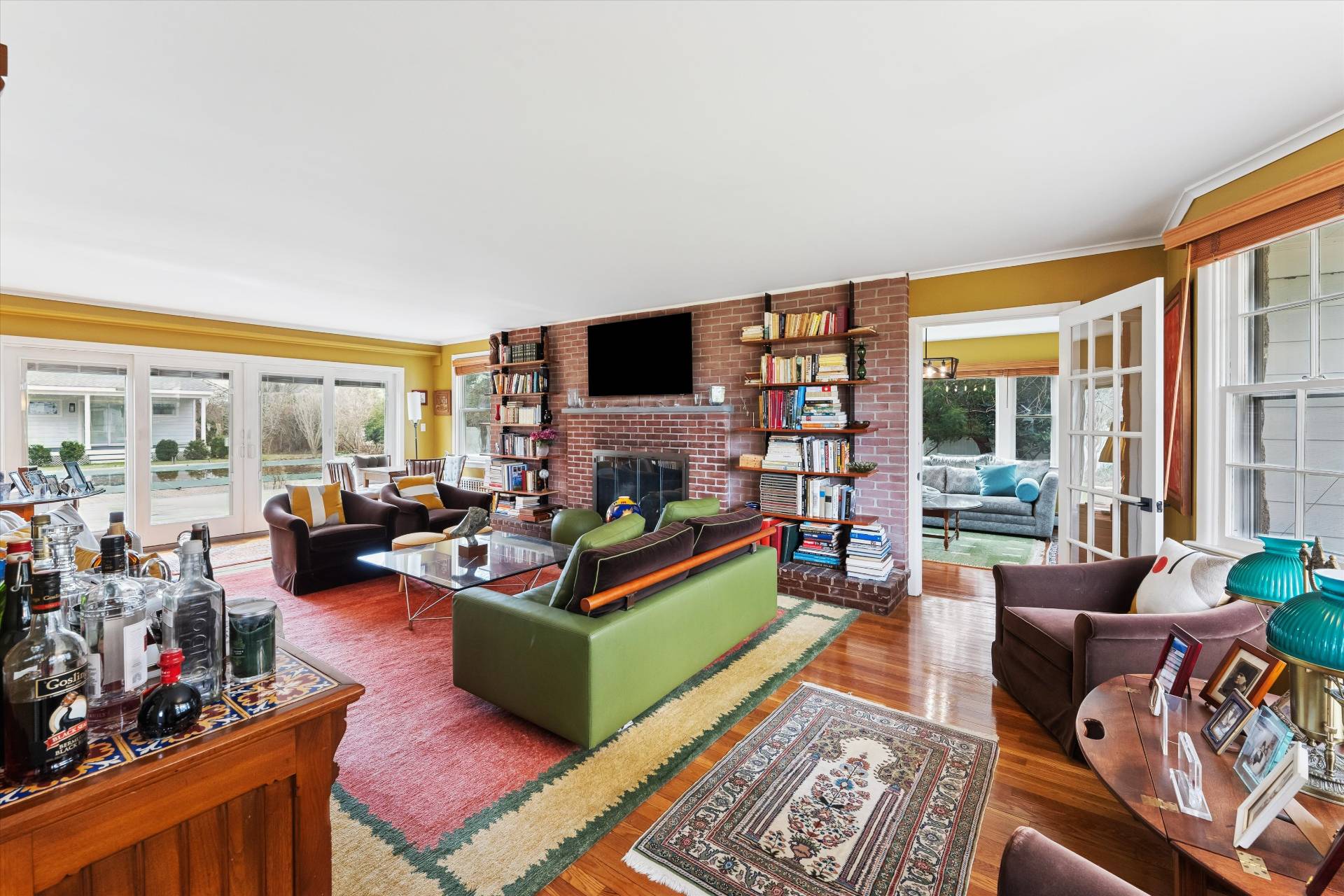 11 Oneck Road Westhampton Beach, NY 11978 - Photo 8 of 34 a living room with furniture large window and a flat screen tv