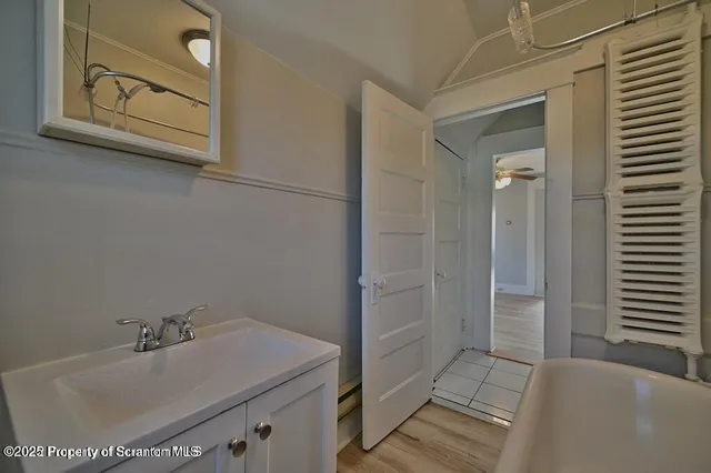 a bathroom with a sink and a mirror