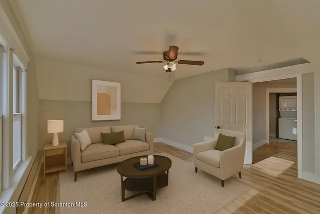 a living room with furniture and a rug