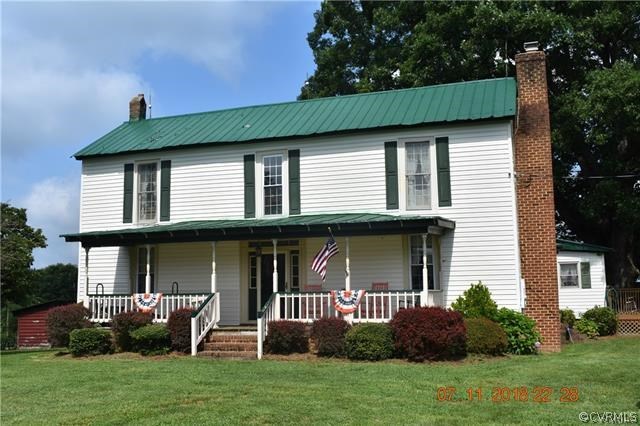 2075 Jonesboro Road Kenbridge, VA 23944 - Photo 1 of 27 a front view of a house with garden