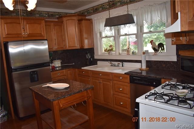 2075 Jonesboro Road Kenbridge, VA 23944 - Photo 8 of 27 a kitchen with a sink stove and refrigerator