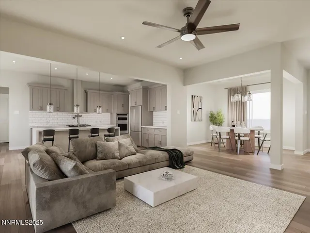 a living room with furniture and kitchen view