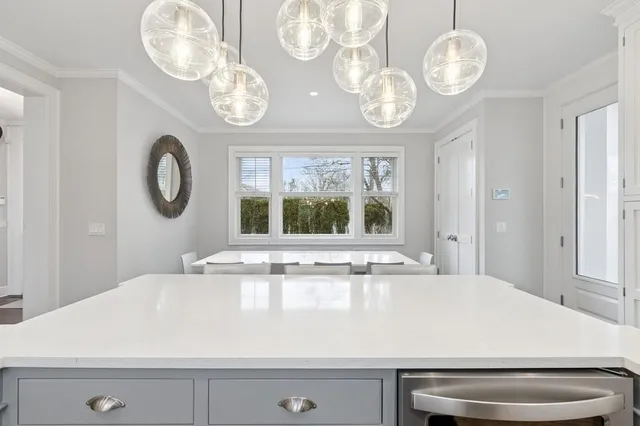 a kitchen with stainless steel appliances granite countertop a stove and a refrigerator