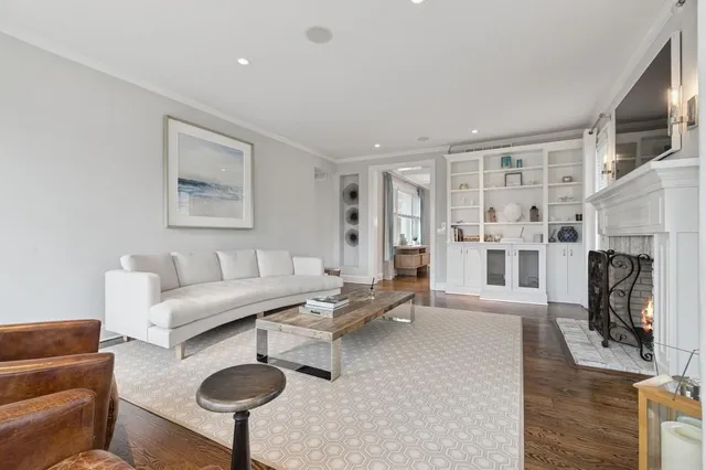 a bedroom with furniture and a wooden floor