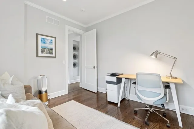 a living room with furniture fireplace and flat screen tv
