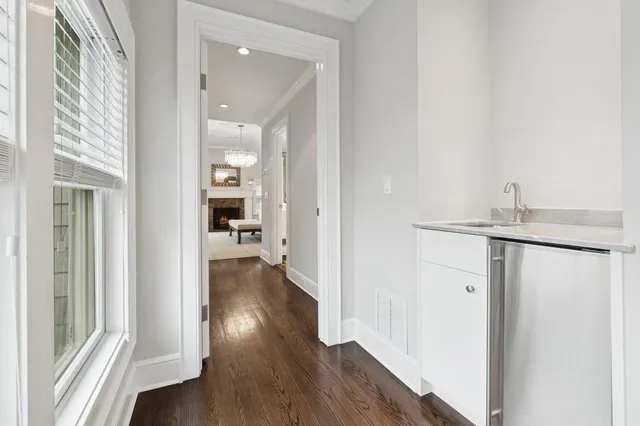 a spacious bedroom with a bed and a fireplace