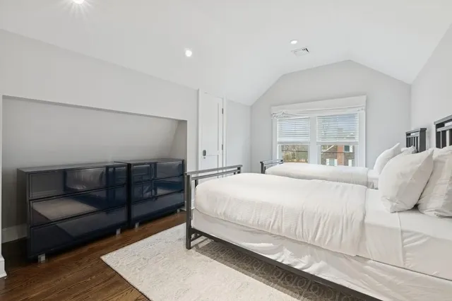 a view of entryway livingroom and hall with wooden floor