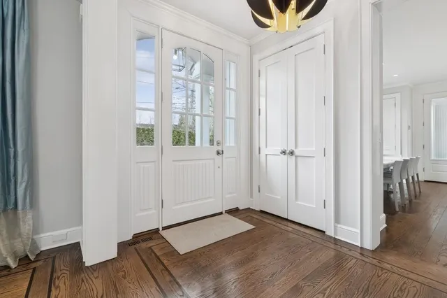 a view of a room with furniture and wooden floor