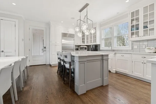 a close view of dining table wooden floor and a window
