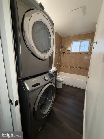 a utility room with sink dryer and washer
