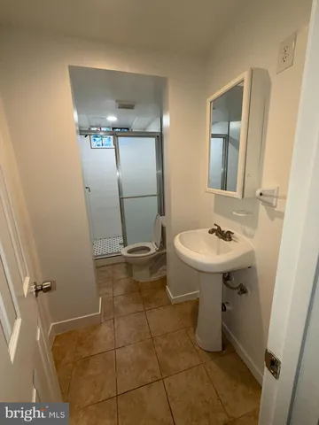 a kitchen with sink cabinets and stainless steel appliances