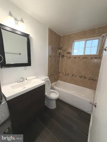 a bathroom with a toilet a sink and a bathtub