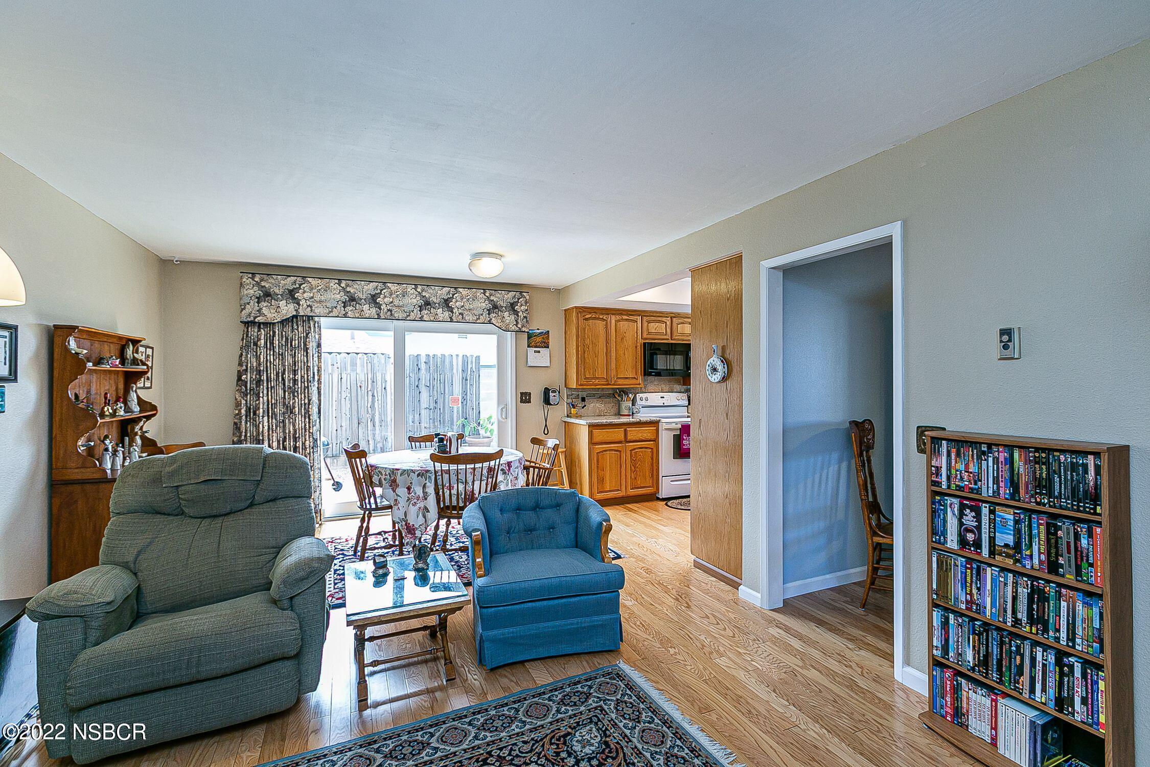 4212 Centaur Avenue Lompoc, CA 93436 - Photo 10 of 30 a living room with furniture and a book shelf