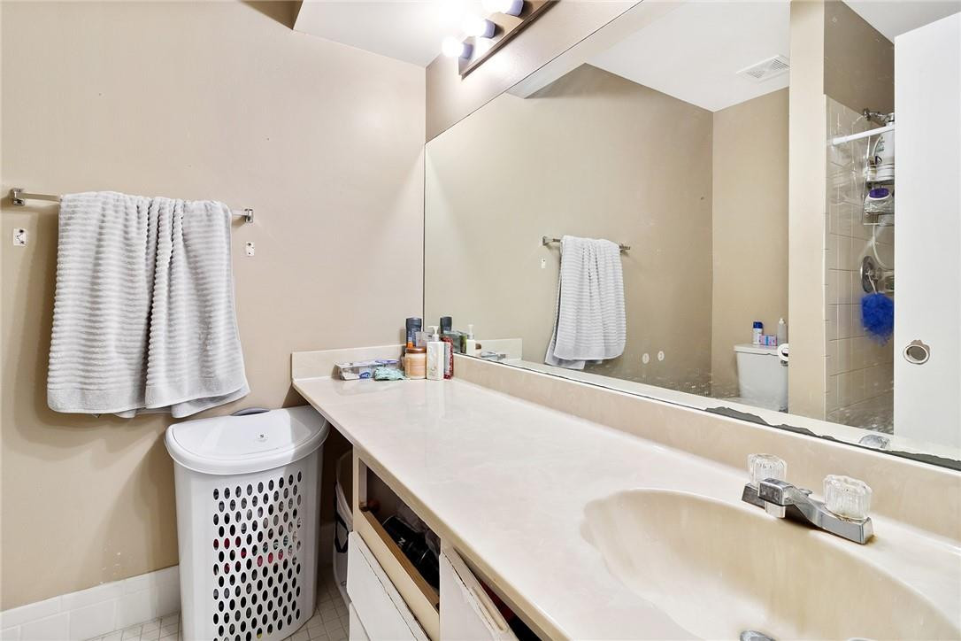7543 Courtyard Run East, Unit 7543 Boca Raton, FL 33433 - Photo 12 of 15 a bathroom with a sink and a mirror