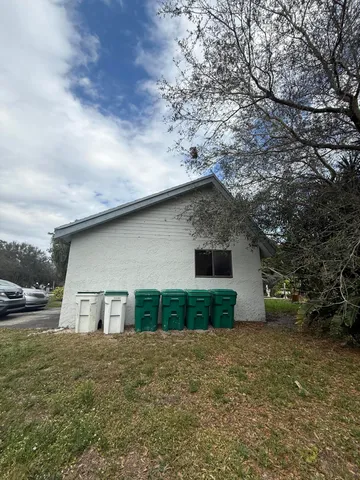 a view of a backyard of the house
