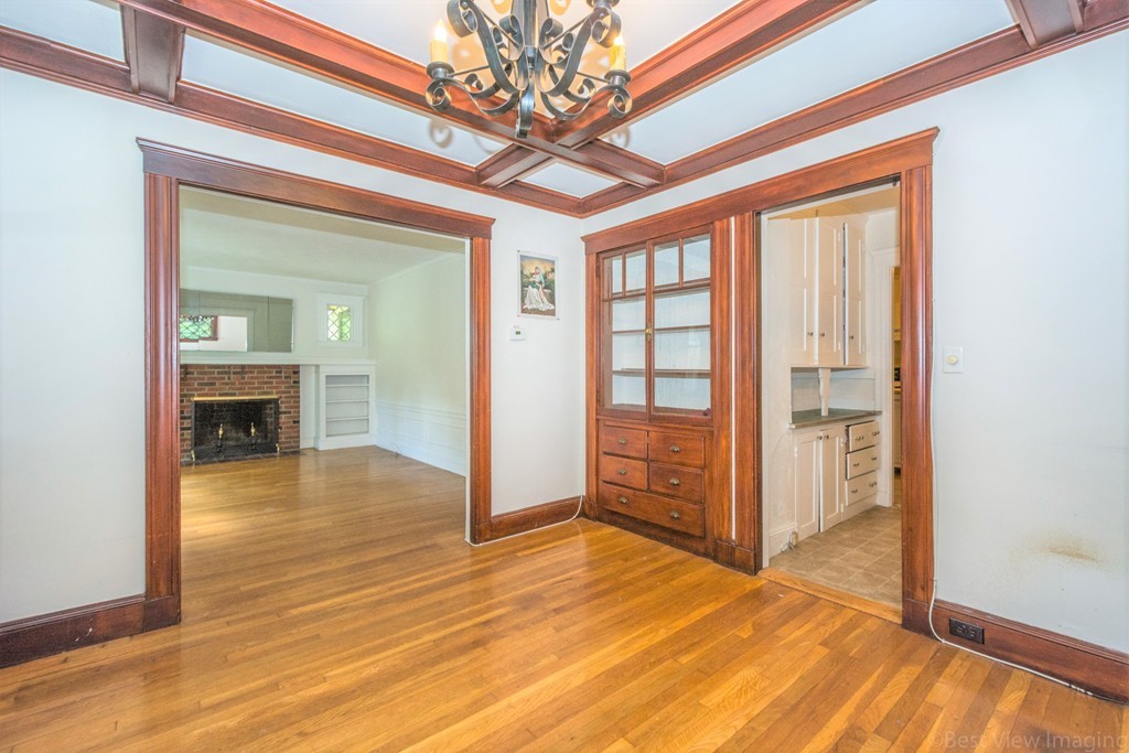 59-61 Brington Road Brookline, MA 02445 - Photo 13 of 19 a view of an empty room with wooden floor and a window