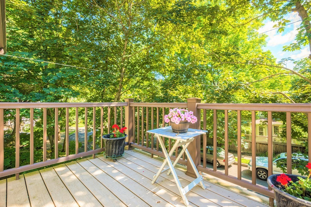 59-61 Brington Road Brookline, MA 02445 - Photo 16 of 19 a deck view with a garden space