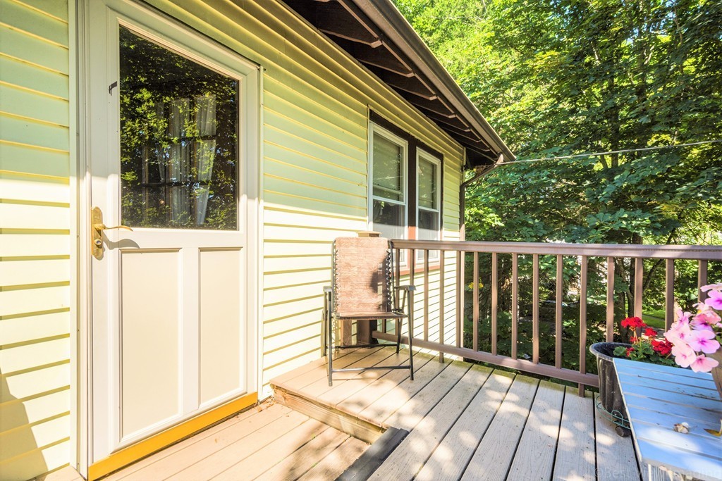 59-61 Brington Road Brookline, MA 02445 - Photo 17 of 19 a view of a wooden deck and a yard