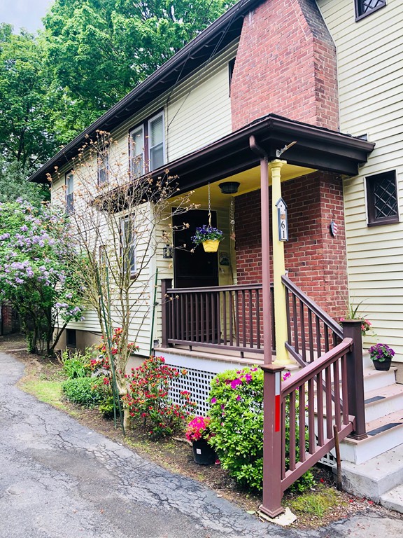 59-61 Brington Road Brookline, MA 02445 - Photo 2 of 19 a view of a small house with wooden deck