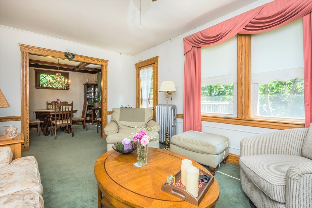 59-61 Brington Road Brookline, MA 02445 - Photo 5 of 19 a living room with furniture and a large window