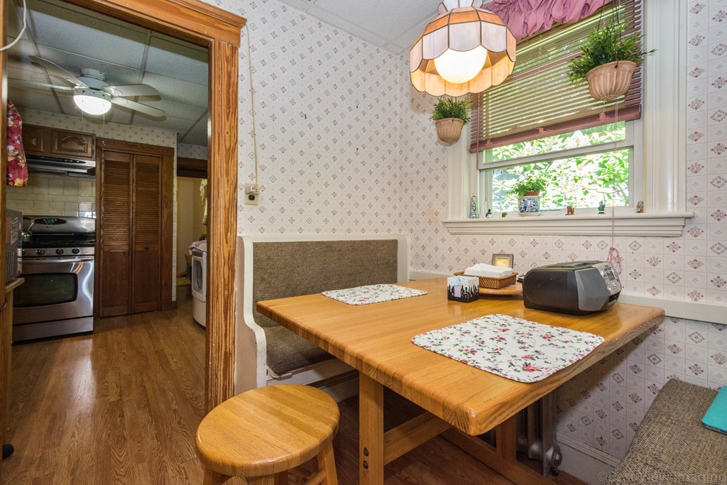 59-61 Brington Road Brookline, MA 02445 - Photo 8 of 19 a view of a dining room with furniture window and wooden floor