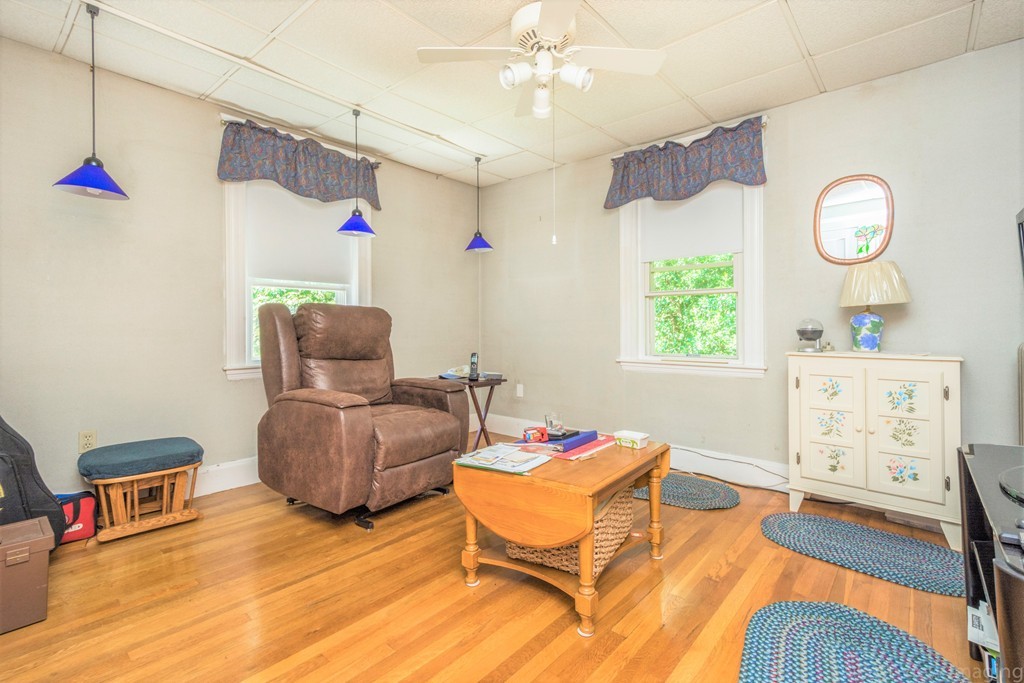59-61 Brington Road Brookline, MA 02445 - Photo 9 of 19 a living room with furniture and a wooden floor