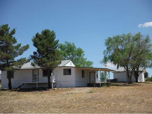 2125 W Road Chino Valley, AZ 86323 - Photo 1 of 20 a house that has a tree in front of it