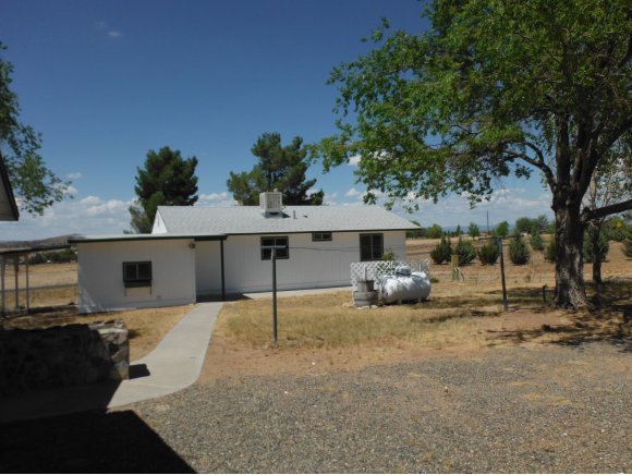 2125 W Road Chino Valley, AZ 86323 - Photo 19 of 20 a front view of a house with garden