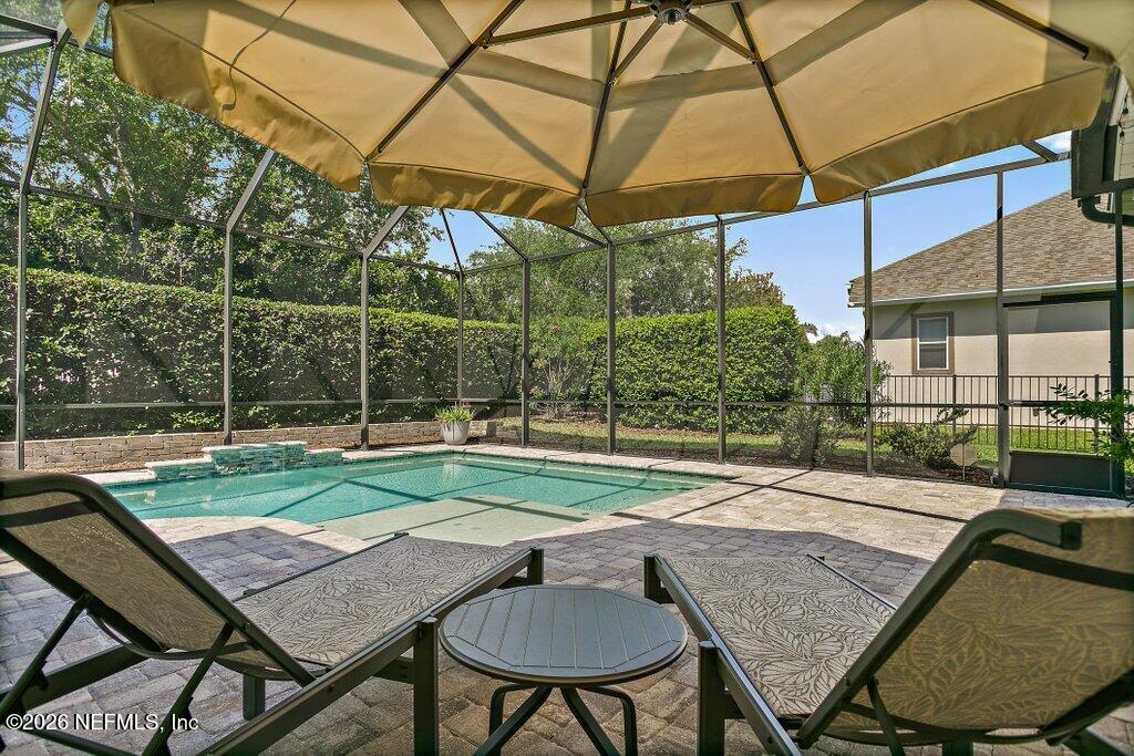 841 Ifield Road St. Augustine, FL 32095 - Photo 45 of 69 a backyard of a house with table and chairs