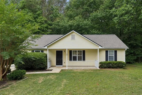 a front view of a house with a yard