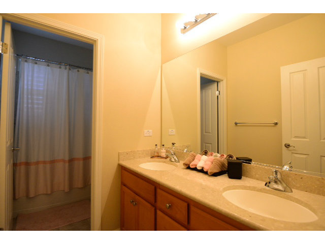 3102 Browntail Way San Ramon, CA 94582 - Photo 10 of 12 a bathroom with a double vanity sink and a mirror