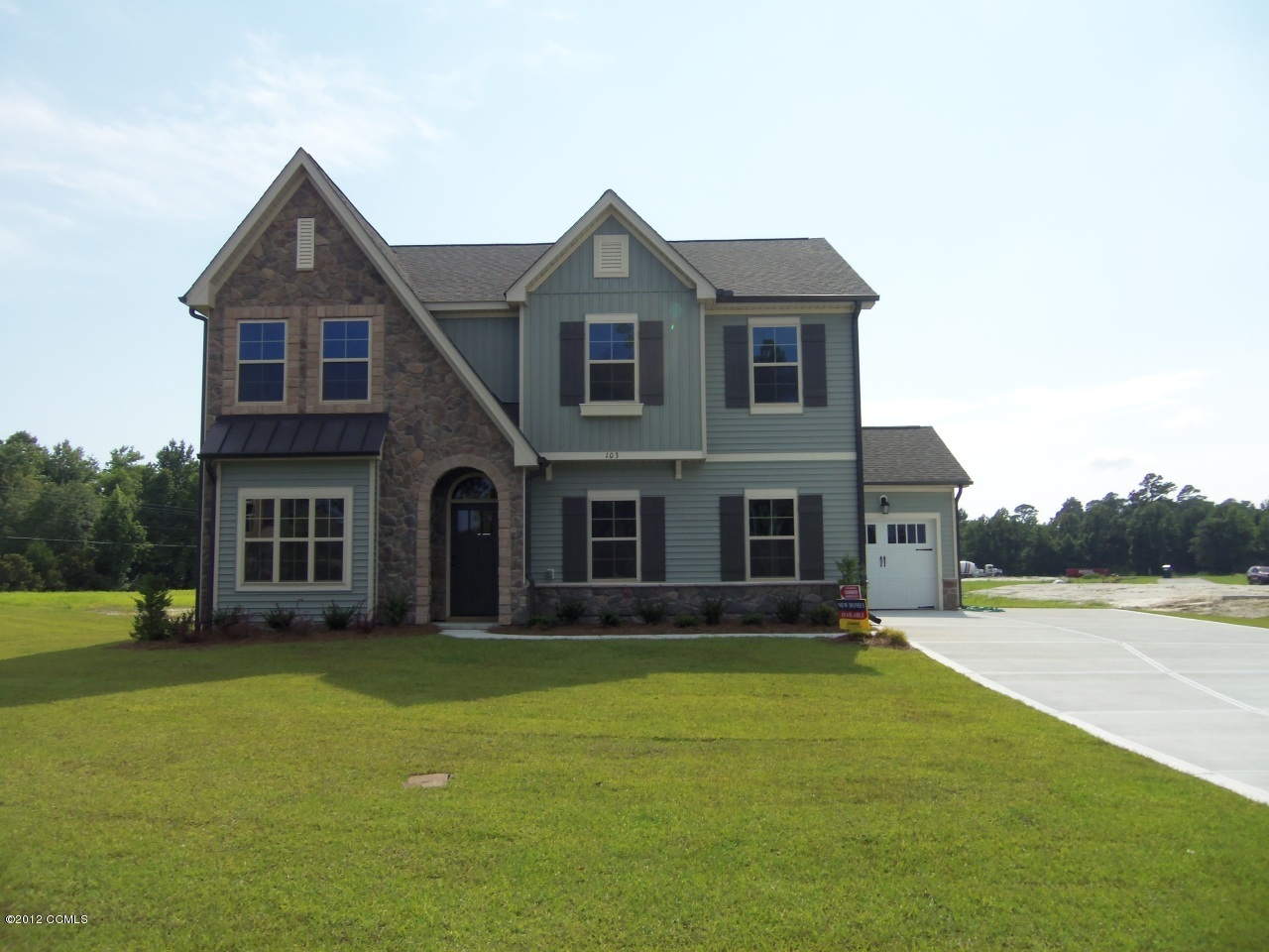 103 Summer Rst Trail Hubert, NC 28539 - Photo 1 of 13 The Benson E features a 3 car garage (2 car sideload, 1 car front load).