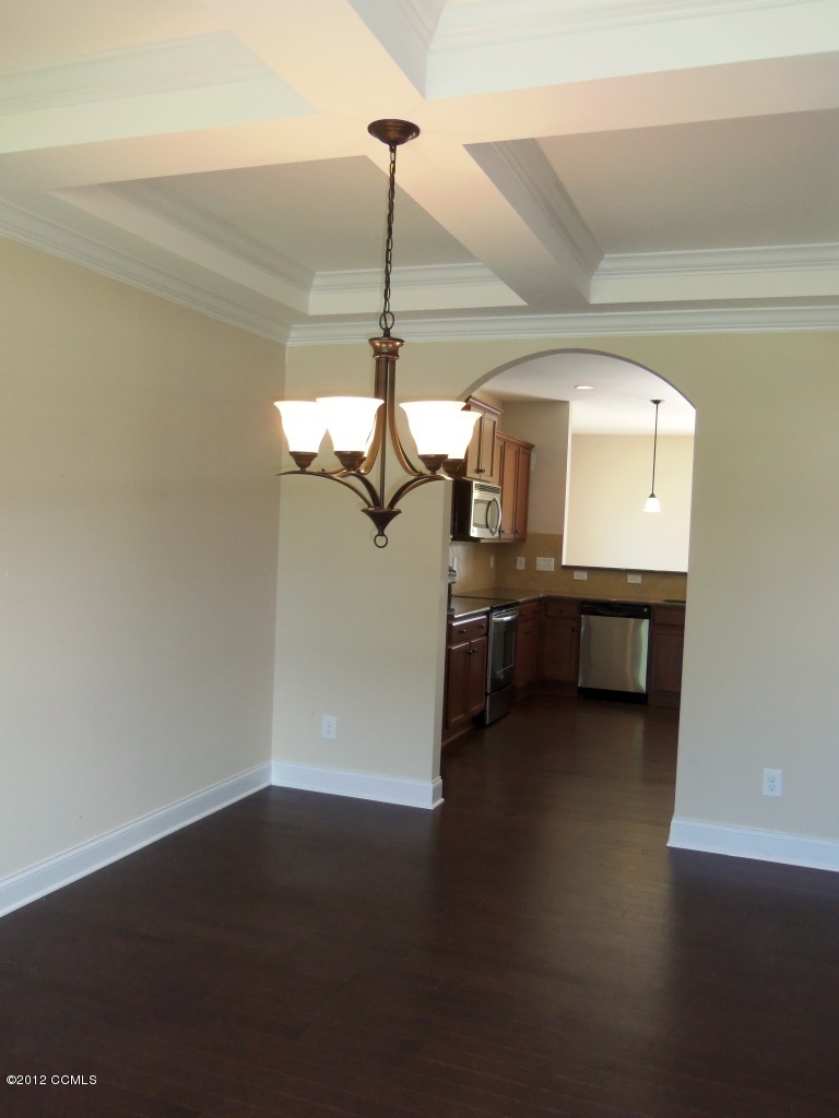 103 Summer Rst Trail Hubert, NC 28539 - Photo 3 of 13 Formal dining room features engineered hardwood flooring and coffered ceilings.