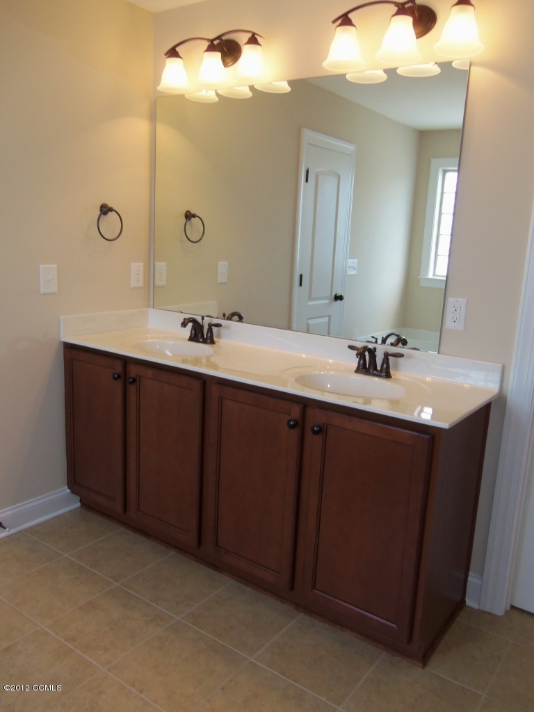 103 Summer Rst Trail Hubert, NC 28539 - Photo 10 of 13 Master bath features tile floors, dual vanity, separate tub and shower, and private water closet.