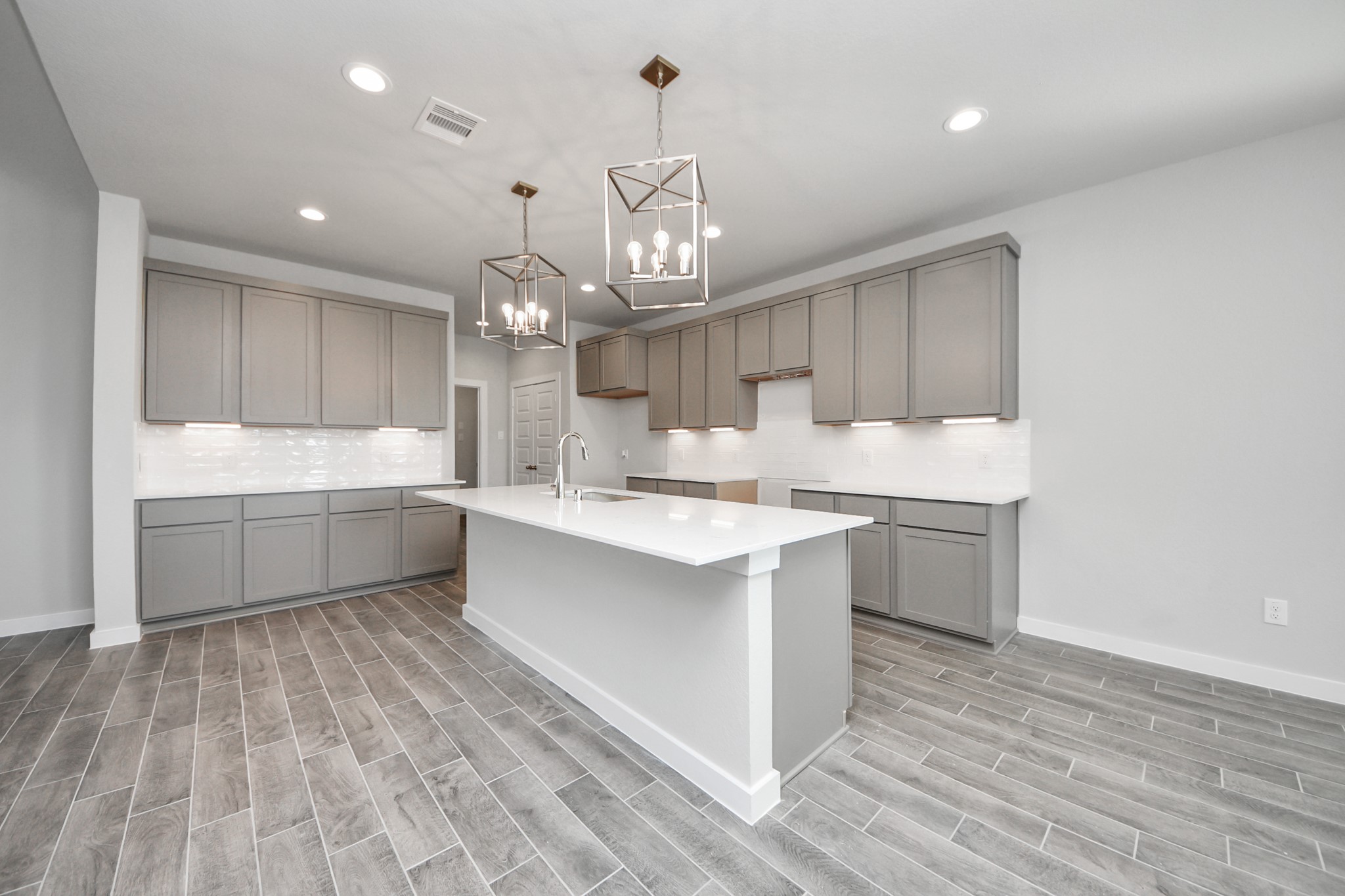 3002 Bury Park Dr Spring Spring, TX 77373 - Photo 14 of 45 The kitchen is a culinary haven, featuring granite countertops, a tile backsplash, stainless steel appliances, 42” upper cabinets, and undercabinet lighting.