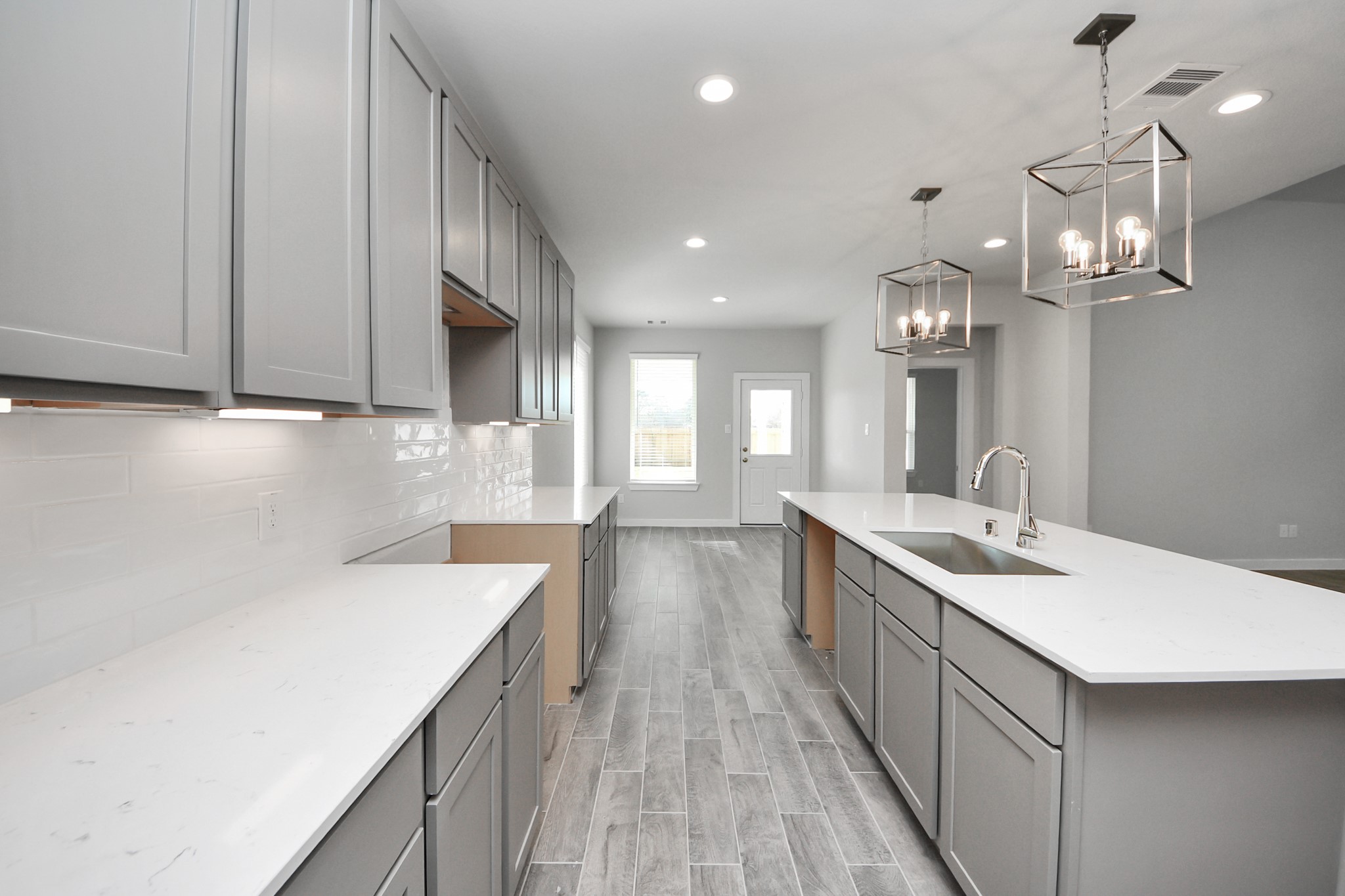 3002 Bury Park Dr Spring Spring, TX 77373 - Photo 18 of 45 a kitchen with a sink stove and cabinets