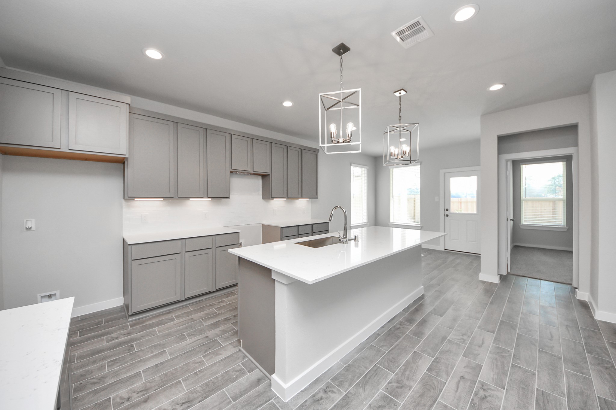 3002 Bury Park Dr Spring Spring, TX 77373 - Photo 19 of 45 a kitchen with a sink stove and cabinets