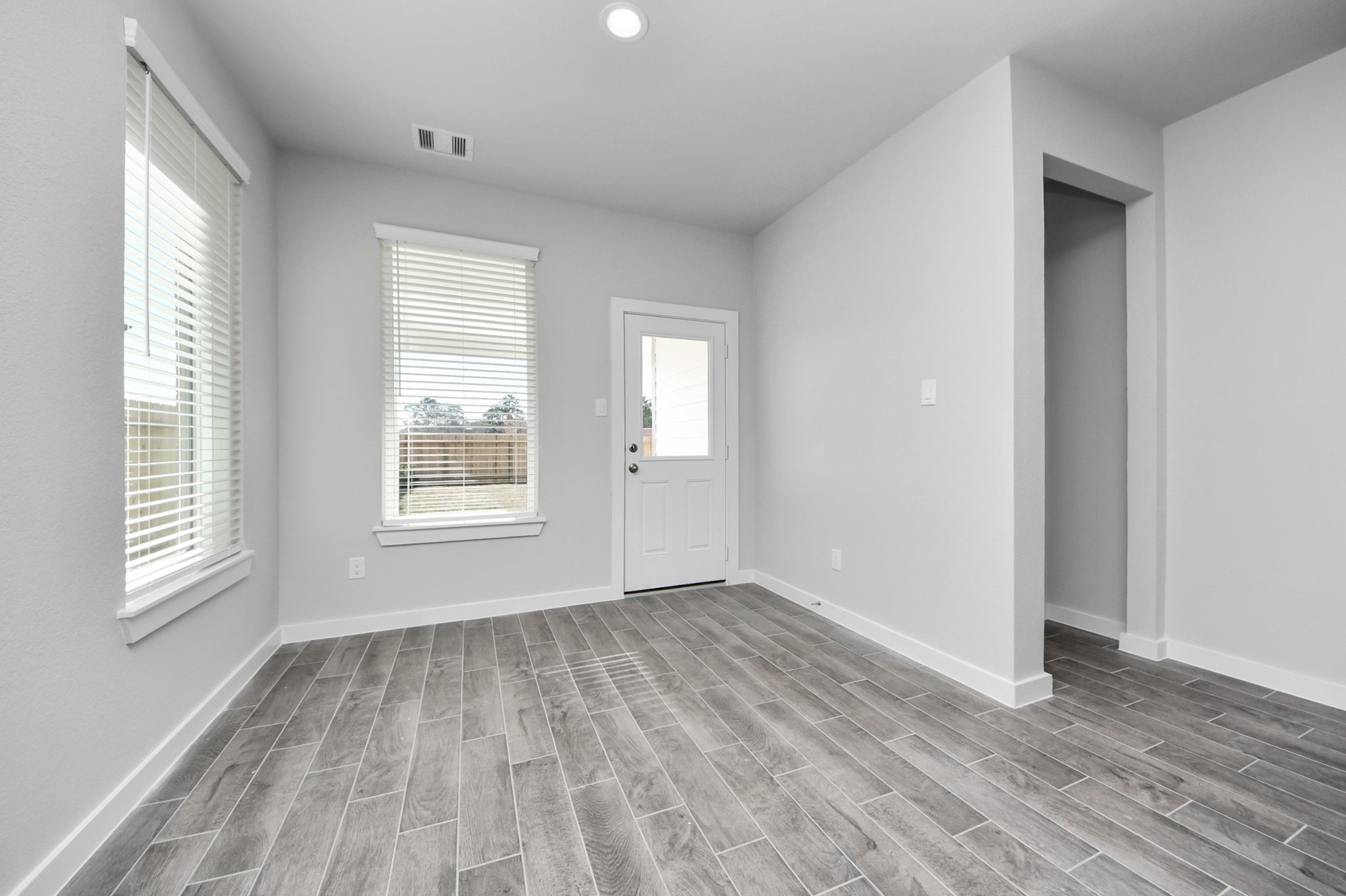 3002 Bury Park Dr Spring Spring, TX 77373 - Photo 20 of 45 a view of an empty room with wooden floor and window